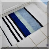 DR06. One of a pair of striped bath mats. 
